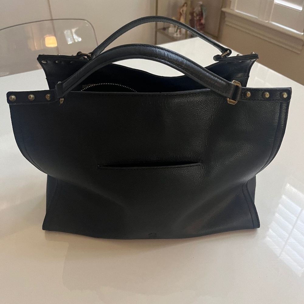Square leather bag with studs detail